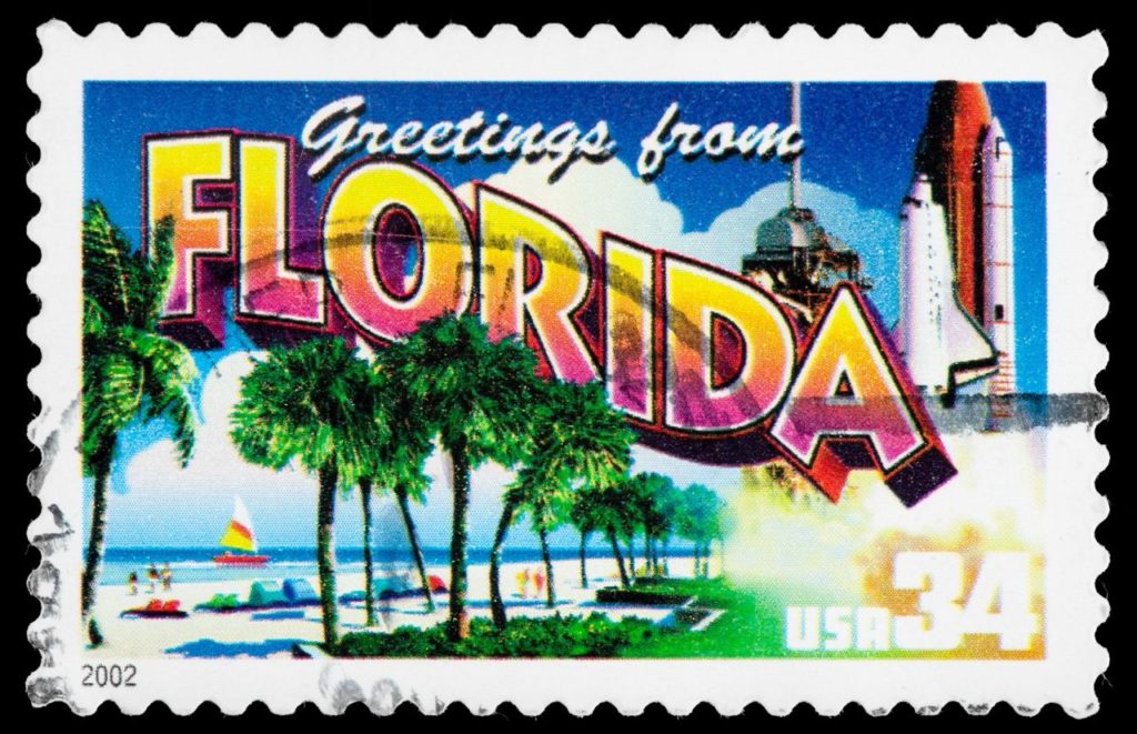 Greetings From Florida Postcard. Keep reading to get the best souvenirs from Florida.
