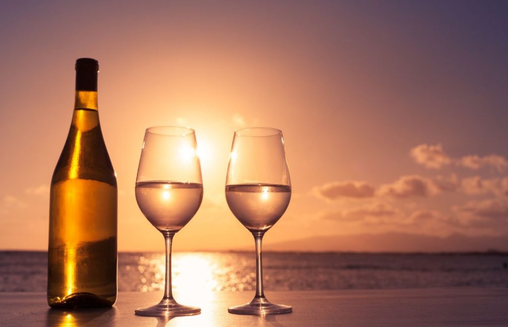 Florida winery enjoying glasses on the beach