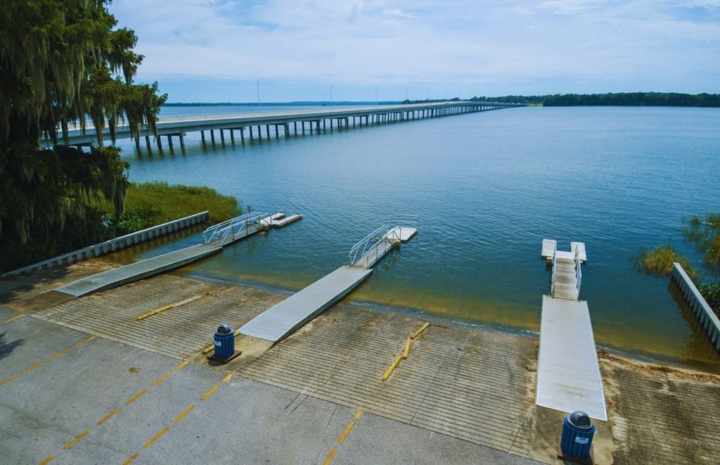 Tavares Florida Lake Harris Boat Dock. Keep reading to find out all you need to know about day trip ideas from Orlando.  