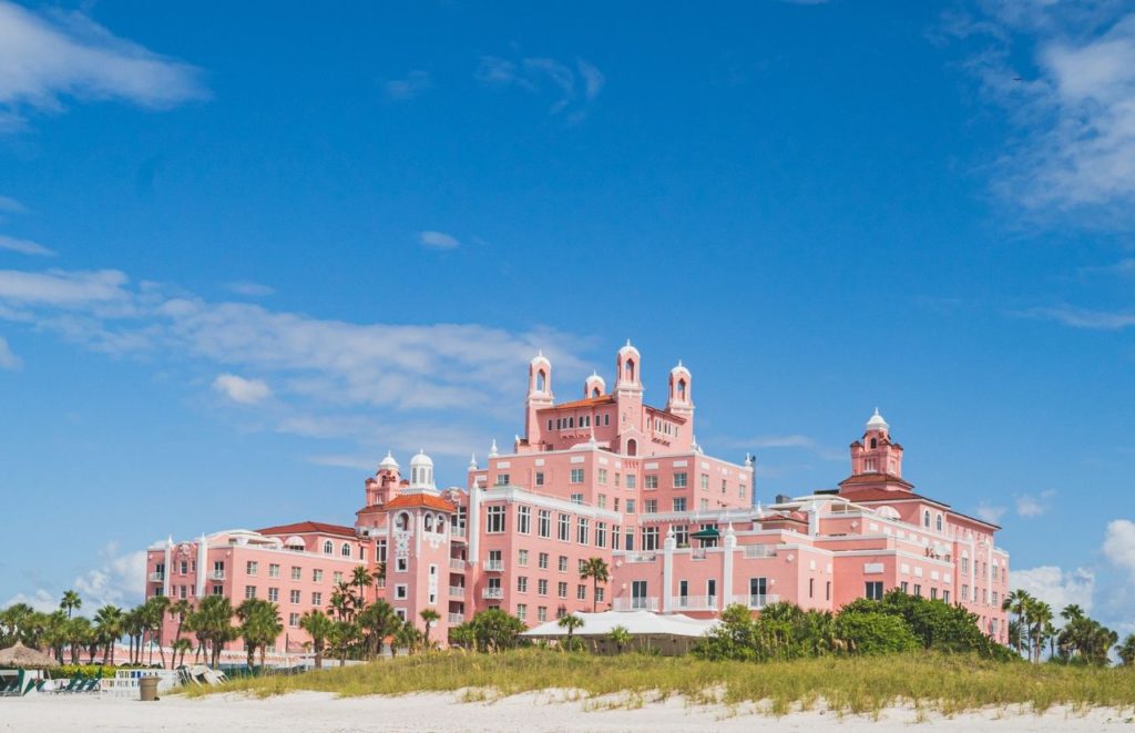 The pink exterior of Loews Don Cesar Pink Hotel in St. Petersburg, Florida. Keep reading for more places to take a perfect day trip from Orlando, Florida. 