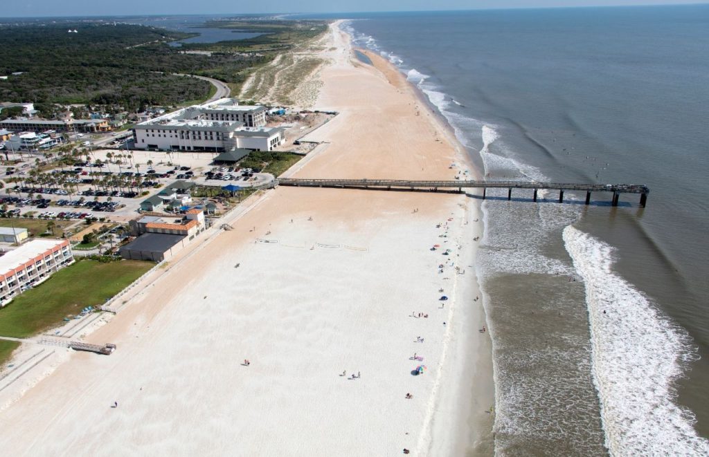 An aerial view of the pier and shoreline at St Augustine Beach, Florida. Keep reading for more places to take a perfect day trip from Orlando, Florida. 