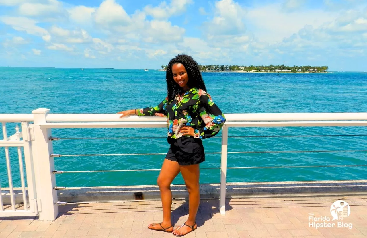 Key West, Florida with NikkyJ in front of the beautiful blue water and ocean