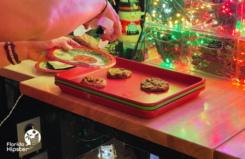 Florida Freshly Baked Chocolate Chip Cookies surrounded by christmas lights and decorations. Keep reading for the best things to do in Gainesville for Christmas. 