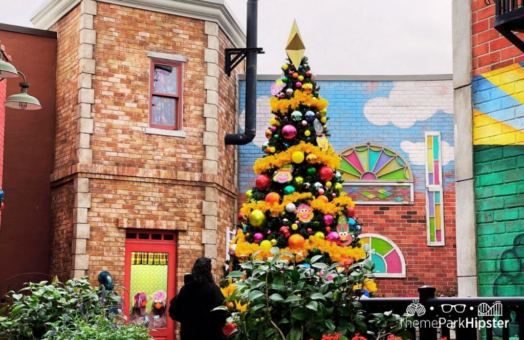 SeaWorld Orlando Resort Christmas Celebration Holiday Tree at Sesame Street Land. Keep reading to learn more about SeaWorld Orlando Sesame Street Land.