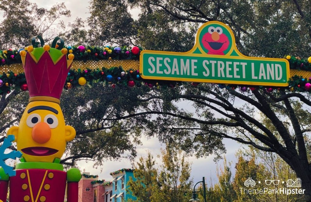 SeaWorld Orlando Resort Christmas Celebration Sesame Street Land Entrance Sign. Keep reading to learn more about SeaWorld Orlando Sesame Street Land.